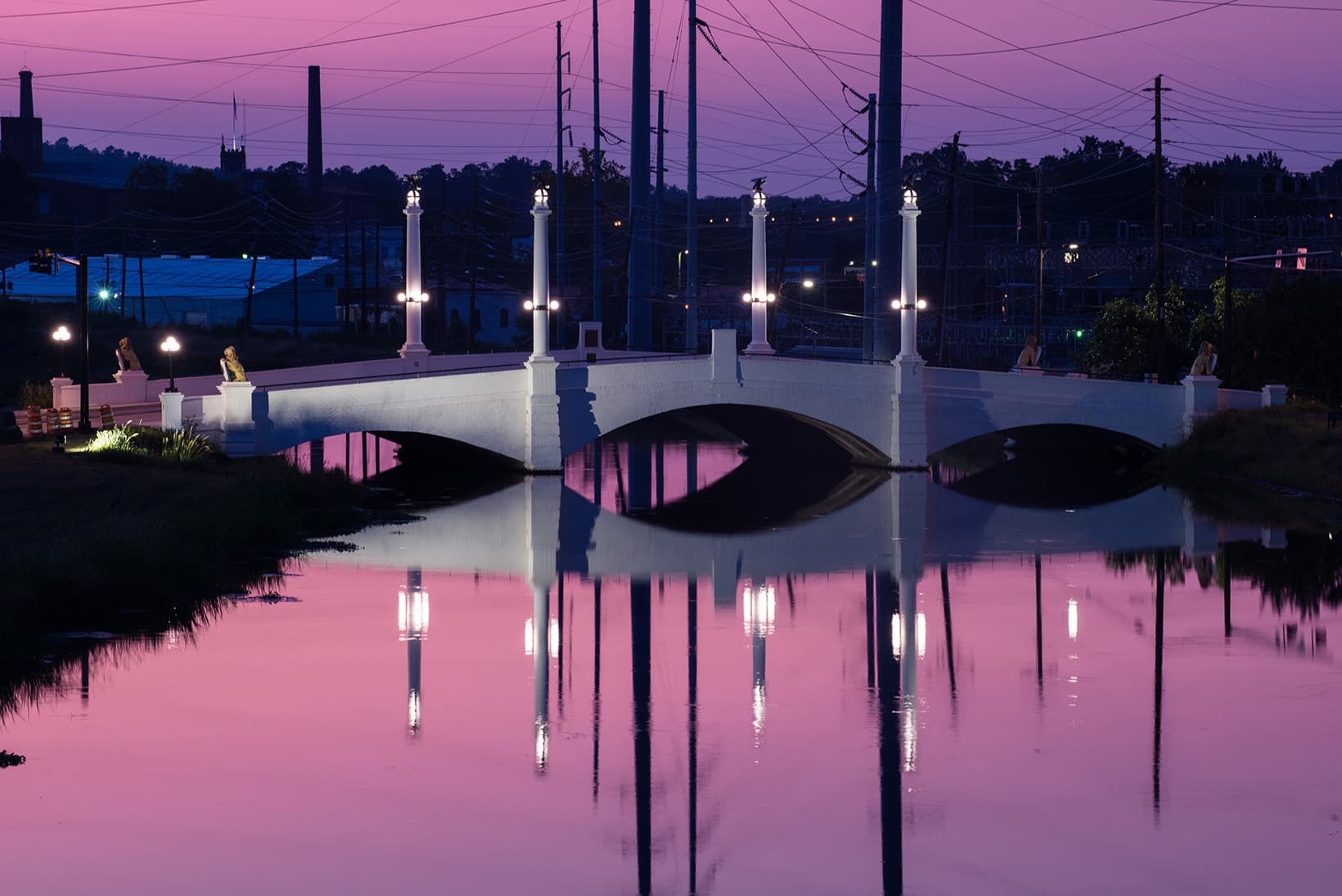 Welcome to Historic Enterprise Mill reflections over water at sunset in local community